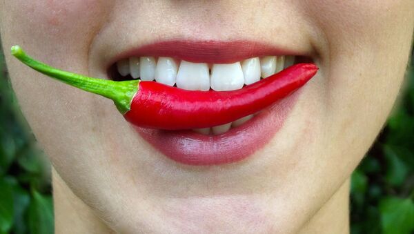 Chili pepper in mouth - Sputnik International