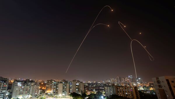 Iron Dome anti-missile system fires interception missiles as rockets are launched from Gaza towards Israel, as seen from the city of Ashkelon, Israel, November 13, 2019 - Sputnik International