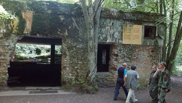 In this July 17, 2004 file photo tourists visit the ruins of Adolf Hitler's headquarters the Wolf's Lair in Gierloz, northeastern Poland, where his chief of staff members made an unsuccessful attempt at Hitler's life on July 20, 1944. Margot Woelk was one of 15 young women who sampled Hitler's food to make sure it wasn’t poisoned before it was served to the Nazi leader in his Wolf's Lair, the heavily guarded command center in what is now Poland, where he spent much of his time in the final years of World War II. Margot Woelk kept her secret hidden from the world, even from her husband then, a few months after her 95th birthday, she revealed the truth about her wartime role. - Sputnik International