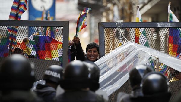 Police block supporters of former President Evo Morales from entering the area of Congress in La Paz, Bolivia, Tuesday, Nov. 12, 2019.  - Sputnik International