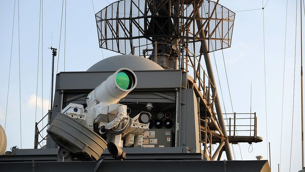 The U.S. Navy Afloat Forward Staging Base (Interim) USS Ponce (AFSB(I)-15) conducts an operational demonstration of the Office of Naval Research (ONR)-sponsored Laser Weapon System (LaWS) while deployed to the Arabian Gulf. - Sputnik International