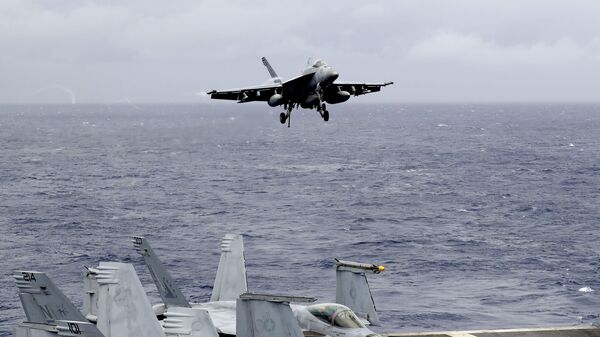 A US fighter jet on the U.S. aircraft carrier in South China Sea. File photo - Sputnik International