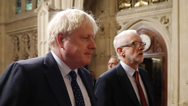 Britain's Prime Minister Boris Johnson (L) and main opposition Labour Party leader Jeremy Corbyn (R) head the procession of members of parliament through the Peers Lobby into the House of Lords to listen to the Queen's Speech during the State Opening of Parliament in the Houses of Parliament in London on October 14, 2019 - Sputnik International