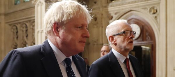 Britain's Prime Minister Boris Johnson (L) and main opposition Labour Party leader Jeremy Corbyn (R) head the procession of members of parliament through the Peers Lobby into the House of Lords to listen to the Queen's Speech during the State Opening of Parliament in the Houses of Parliament in London on October 14, 2019 - Sputnik International