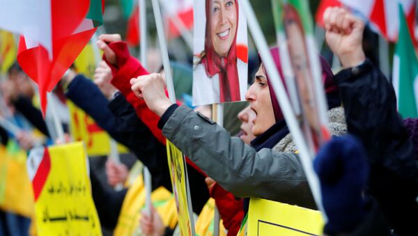 People attend a protest organised by National Council of Resistance of Iran in Germany to support nationwide demonstrations in Iran against the rise in gasoline prices, in Berlin, Germany November 17, 2019 - Sputnik International
