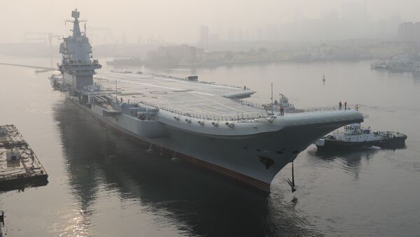 (FILES) In this file photo taken on May 13, 2018, China's first domestically manufactured aircraft carrier, known only as Type 001A, leaves port in the northeastern city of Dalian - Sputnik International