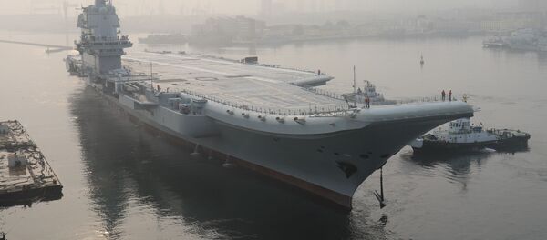(FILES) In this file photo taken on May 13, 2018, China's first domestically manufactured aircraft carrier, known only as Type 001A, leaves port in the northeastern city of Dalian - Sputnik International