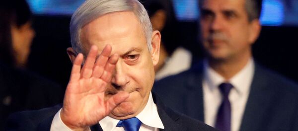 Israeli Prime Minister Benjamin Netanyahu waves after addressing members of his right-wing party bloc at a conference in Tel Aviv, Israel November 17, 2019. REUTERS/Nir Elias - Sputnik International