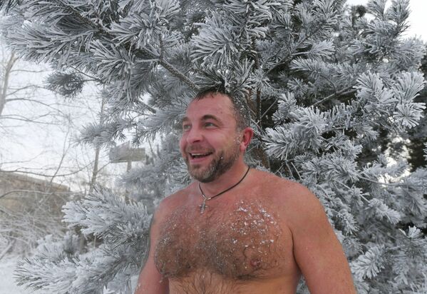 A man smiles after a swim in the icy water in Krasnoyarsk - Sputnik International