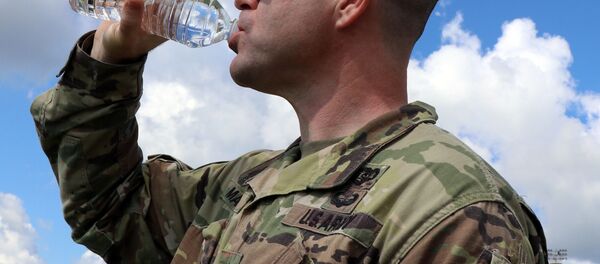 A combat medic assigned to Blanchfield’s LaPointe Army Medical Home on Fort Campbell, drinks from a 16 ounce bottle of water to maintain his hydration for optimal performance. On average, the Army recommends men should consume about 100 ounces of fluid (3 liters) each day, and women should aim for about 70 ounces (2 liters) for baseline hydration.  - Sputnik International