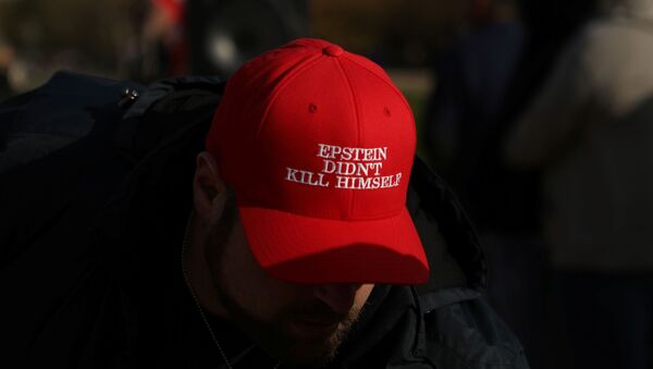 An attendee wears a hat that says Epstein Didn't Kill Himself as militia members and pro-gun rights activists participating in the Declaration of Restoration rally listen to speakers in Washington, DC, 9 November 2019 - Sputnik International