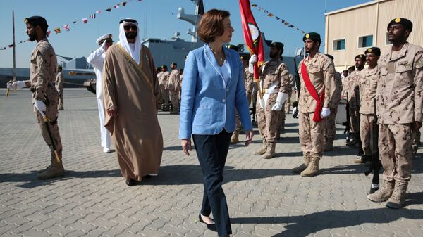 French Defence Minister Florence Parly and United Arab Emirates' Minister of State for Defence Mohammed Bin Ahmad al-Bawardi inspect members of an honour guard during a military ceremony at the French Naval Base in Abu Dhabi, United Arab Emirates November 24, 2019 - Sputnik International