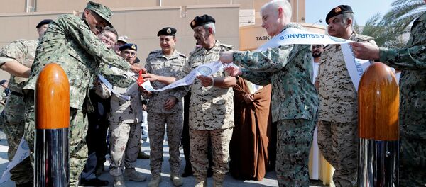 Commander-in-Chief of Bahrain Defense Force (BDF), Field Marshal Sheikh Khalifa bin Ahmed Al Khalifa (C), Commander of Royal Saudi Naval Forces, Let Gen Admiral Fahad bin Abdullah Al-Ghofaily and Vice Admiral U.S. Naval Forces Central Command, James Malloy cut the ribbon as they inaugurate International Maritime Security Construct at U.S. Naval Base in Manama, Bahrain, November 7, 2019 - Sputnik International