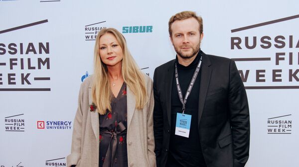 Russian director Klim Shipenko and star actress Maria Mironova pose ahead of the screening of the film 'Servant' at the ODEON Luxe Leicester Square in London, UK on 24 November. - Sputnik International
