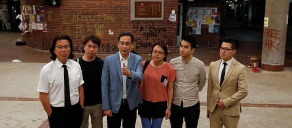 Pro-democratic lawmakers talk to the media after meeting with protesters at the Polytechnic University (PolyU) in Hong Kong, China November 25, 2019. - Sputnik International