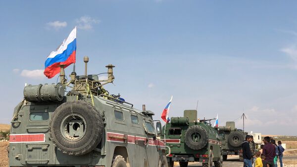 Russian military police armored vehicles in the town of Kobani - Sputnik International