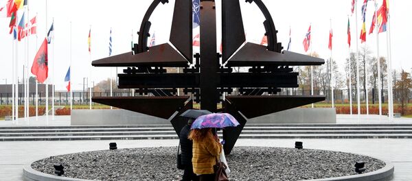People hold umbrellas outside NATO headquarters in Brussels, Belgium, November 26, 2019 People hold umbrellas outside NATO headquarters in Brussels, Belgium, November 26, 2019 - Sputnik International
