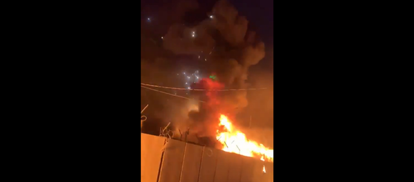 Video footage captures moment anti-government protesters torch Iranian consulate in Najaf, Iraq. Video footage captures moment anti-government protesters torch Iranian consulate in Najaf, Iraq. - Sputnik International