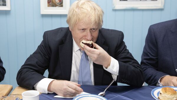 Britain's Prime Minister Boris Johnson enjoys a cream tea while touring 'Rodda's Clotted Cream', in Redruth, Britain 27 November 2019 - Sputnik International