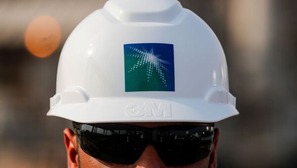  An employee in a branded helmet is pictured at Saudi Aramco oil facility in Abqaiq, Saudi Arabia October 12, 2019 - Sputnik International