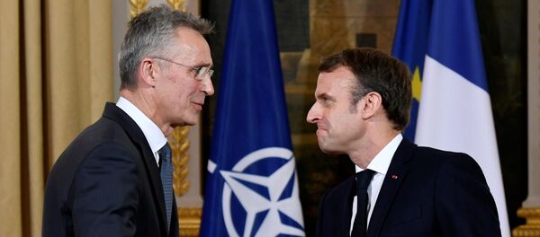 NATO Secretary-General Jens Stoltenberg and French President Emmanuel Macron shake hands at the end of a news conference after their meeting at the Elysee palace in Paris, France November 28, 2019.  - Sputnik International