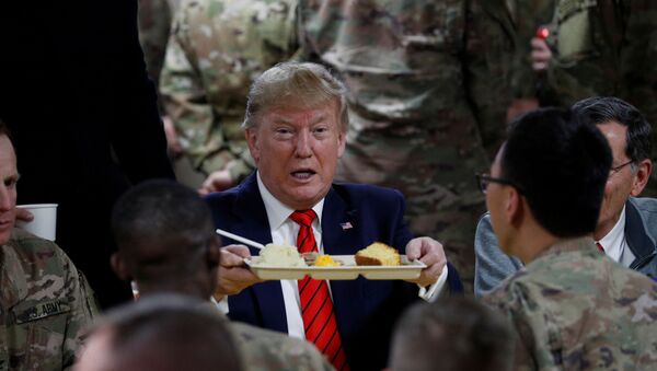 U.S. President Donald Trump eats dinner with U.S. troops at a Thanksgiving dinner event during a surprise visit at Bagram Air Base in Afghanistan, November 28, 2019 - Sputnik International