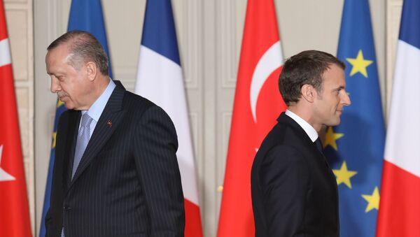 (FILES) In this file photo taken on January 5, 2018, French President Emmanuel Macron (R) and Turkish President Recep Tayyip Erdogan walk during a joint press conference, at the Elysee Palace in Paris. The French government will summon the Turkish envoy in Paris for talks after what it termed insults by Turkey's President Recep Tayyip Erdogan, who accused Emmanuel Macron of suffering brain death, the president's office said on November 29, 2019. - Sputnik International