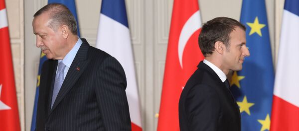 (FILES) In this file photo taken on January 5, 2018, French President Emmanuel Macron (R) and Turkish President Recep Tayyip Erdogan walk during a joint press conference, at the Elysee Palace in Paris. The French government will summon the Turkish envoy in Paris for talks after what it termed insults by Turkey's President Recep Tayyip Erdogan, who accused Emmanuel Macron of suffering brain death, the president's office said on November 29, 2019. (FILES) In this file photo taken on January 5, 2018, French President Emmanuel Macron (R) and Turkish President Recep Tayyip Erdogan walk during a joint press conference, at the Elysee Palace in Paris. The French government will summon the Turkish envoy in Paris for talks after what it termed insults by Turkey's President Recep Tayyip Erdogan, who accused Emmanuel Macron of suffering brain death, the president's office said on November 29, 2019. - Sputnik International