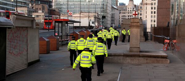 Police officers walk near the scene of a stabbing on London Bridge Police officers walk near the scene of a stabbing on London Bridge - Sputnik International