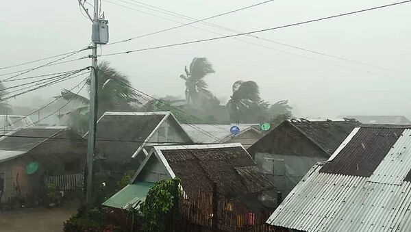 This handout image taken and received on December 2, 2019 courtesy of Gladys Vidal shows heavy rains and moderate wind from Typhoon Kammuri battering houses in Gamay town, Northern Samar province - Sputnik International