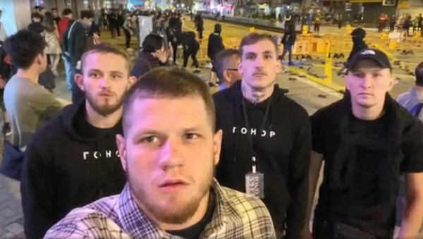 Members of the far-right Ukrainian group Gonor pose during a street protest in Hong Kong - Sputnik International