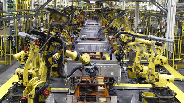 In this Sept. 27, 2018, file photo robots weld the bed of a 2018 Ford F-150 truck on the assembly line at the Ford Rouge assembly plant in Dearborn, Mich. - Sputnik International