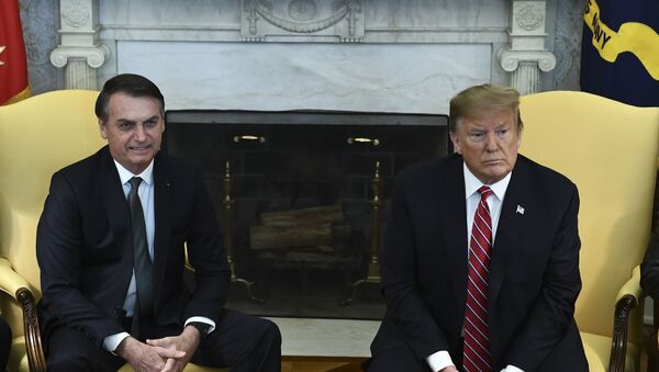 In this file photo taken on March 19, 2019 US President Donald Trump(R)and Brazilian President Jair Bolsonaro meet in the Oval Office at the White House in Washington,DC. - Sputnik International