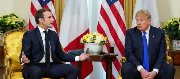 U.S. President Donald Trump looks on as France's President Emmanuel Macron talks, during a meeting ahead of the NATO summit in Watford, in London, Britain, December 3, 2019 - Sputnik International