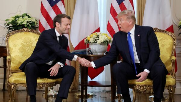 U.S. President Donald Trump shakes hands with France's President Emmanuel Macron, ahead of the NATO summit in Watford, in London, Britain, December 3, 2019 - Sputnik International