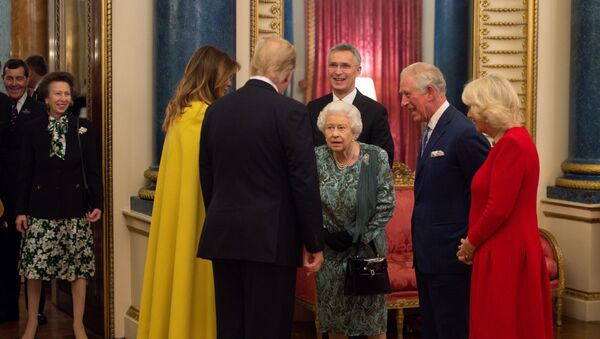 US President Donald Trump and his wife Melania are seen together with Britain's Prince Charles and Camilla, Duchess of Cornwall during a reception at Buckingham Palace to commemorate the 70-year anniversary of the NATO Alliance, hosted by the UK's Queen Elizabeth, in London, 3 December 2019. - Sputnik International