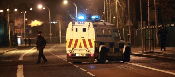 The Police Service of Northern Ireland secure the Falls road close to the scene of a bomb attack in West Belfast, Saturday, March, 15, 2014 - Sputnik International