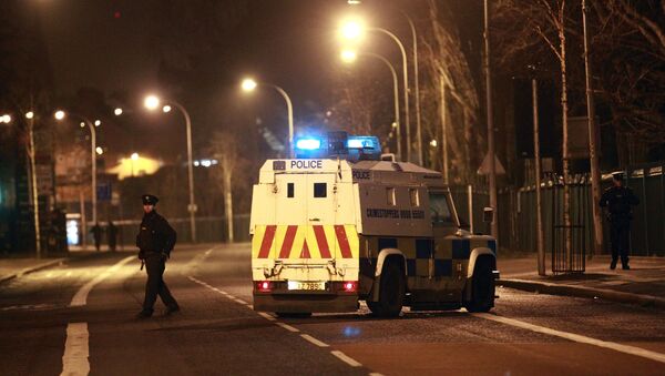 The Police Service of Northern Ireland secure the Falls road close to the scene of a bomb attack in West Belfast, Saturday, March, 15, 2014 - Sputnik International
