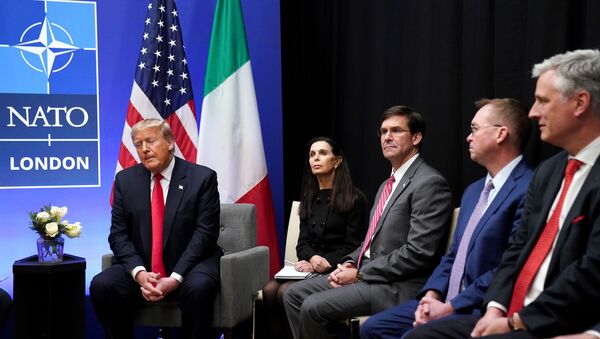 U.S. President Donald Trump speaks as U.S. Defense Secretary Mark Esper and Acting White House Chief of Staff Mick Mulvaney look on during a bilateral meeting with Italian Prime Minister Giuseppe Conte on the sidelines of the NATO summit in Watford, Britain, December 4, 2019. REUTERS/Kevin Lamarque - Sputnik International