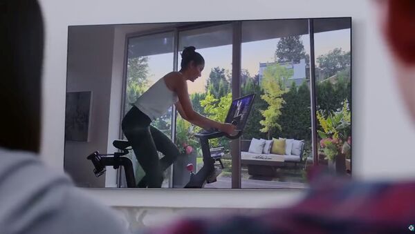An actor is pictured in this screengrab from The Gift That Gives Back exercise bike commercial by Peloton obtained December 4, 2019.  - Sputnik International