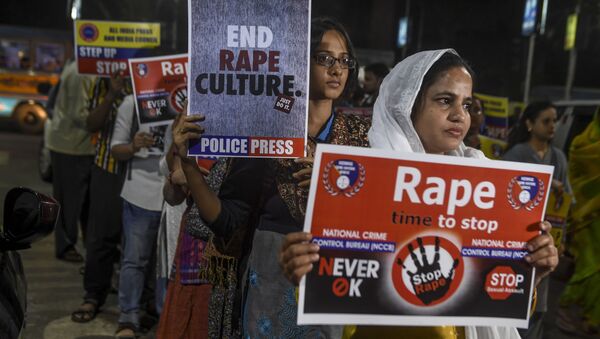 Demonstrators hold placards to protest against sexual assaults on women, following the alleged gang-rape and murder of a 27-year-old veterinarian in Hyderabad and other recent sexual assaults, during a march in Kolkata on 4 December 2019 - Sputnik International