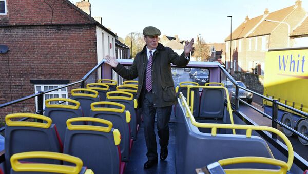 Brexit Party leader Nigel Farage on the party's campaign bus while on the General Election campaign trail in Worksop, England, Tuesday, 3 December 2019 - Sputnik International