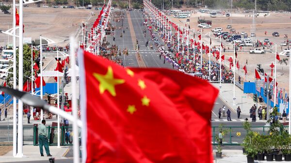A Chinese national flag flies in front of a Chinese-built main road, before a welcome ceremony for China's President Xi Jinping ahead of the APEC Summit in Port Moresby, Papua New Guinea November 16, 2018 - Sputnik International