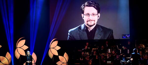 Former Right Livelihood laureate Edward Snowden speaks from a video screen during the 2019 Right Livelihood Award ceremony at Cirkus, Stockholm, Sweden 4 December 2019 - Sputnik International