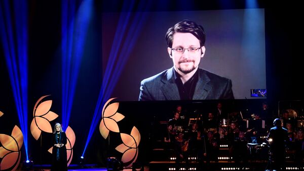 Former Right Livelihood laureate Edward Snowden speaks from a video screen during the 2019 Right Livelihood Award ceremony at Cirkus, Stockholm, Sweden 4 December 2019 - Sputnik International