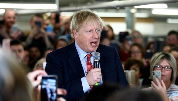Britain's Prime Minister Boris Johnson delivers a speech to workers during a Conservative Party general election campaign visit to John Smedley Mill in Matlock, central England, on December 5, 2019.  - Sputnik International