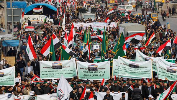 Iraqi demonstrators gather during ongoing anti-government protests in Baghdad, Iraq December 6, 2019 - Sputnik International