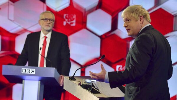 Opposition Labour Party leader Jeremy Corbyn, left, and Britain's Prime Minister Boris Johnson, during a head to head live Election Debate at the BBC TV studios - Sputnik International