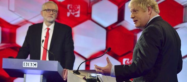 Opposition Labour Party leader Jeremy Corbyn, left, and Britain's Prime Minister Boris Johnson, during a head to head live Election Debate at the BBC TV studios - Sputnik International