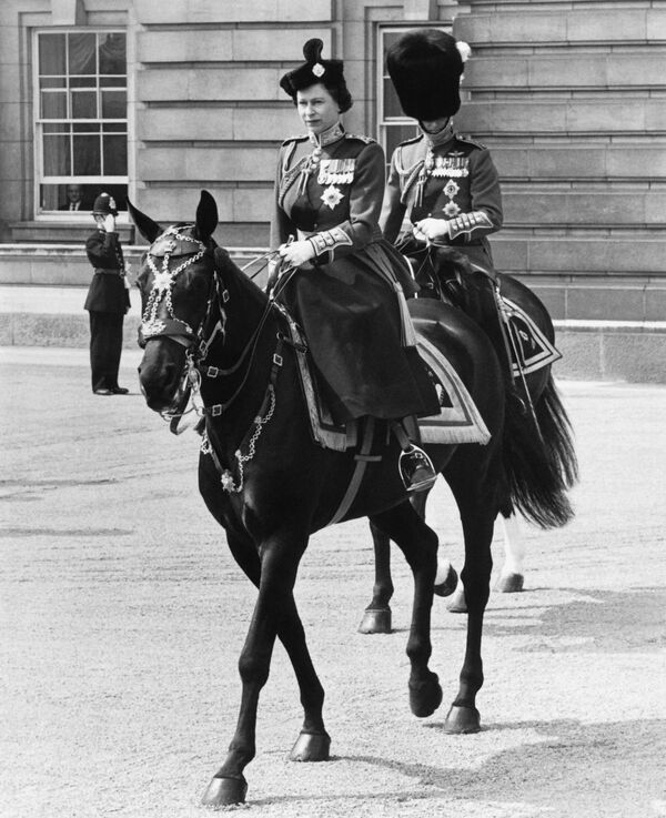 Britain's Queen Elizabeth II and Prince Philip, The Duke of Edinburgh ride back to Buckingham Palace after The Queen's Birthday Parade, Trooping the Colour at Horse Guards Parade in London on June 14, 1969 - Sputnik International
